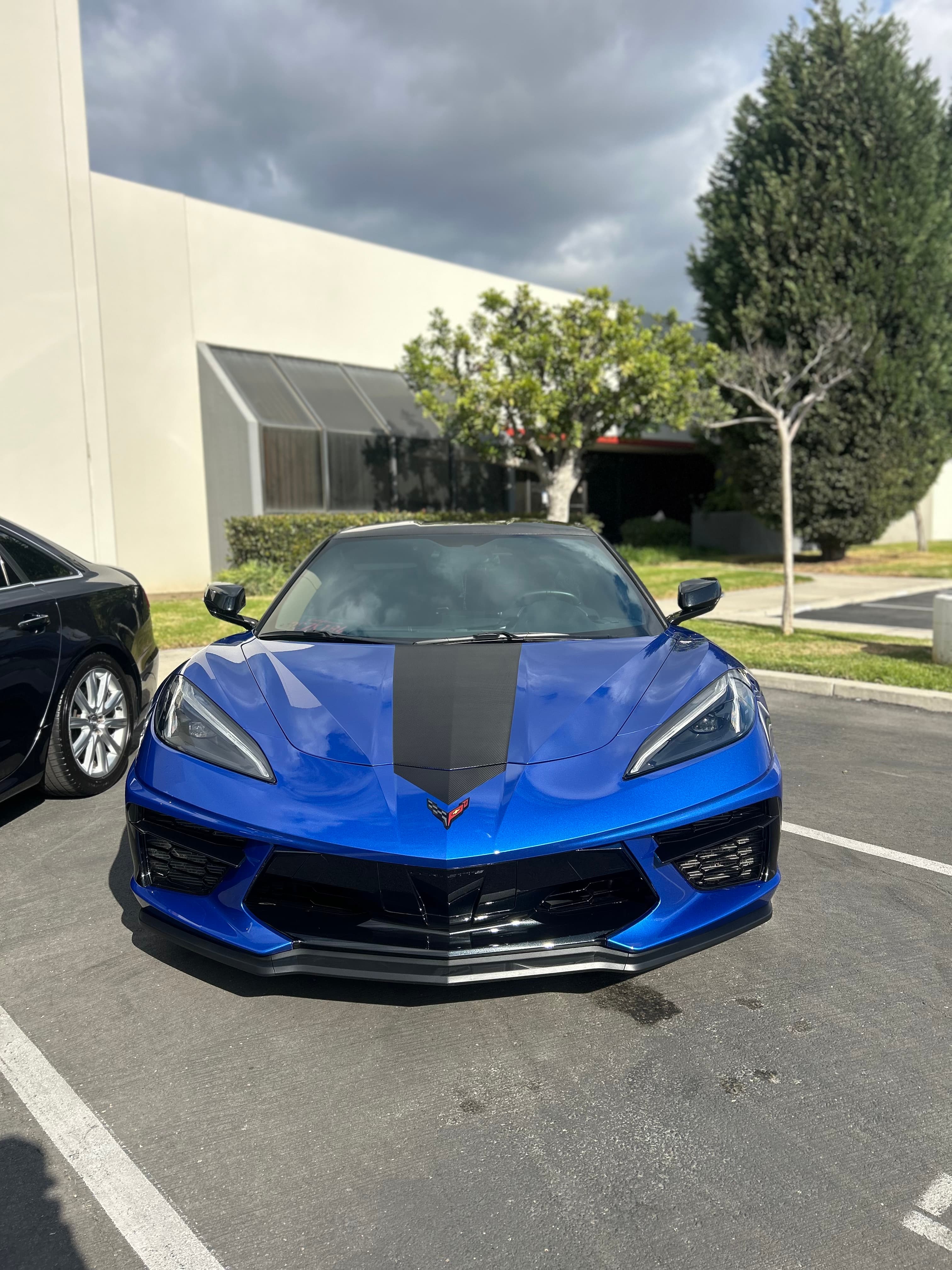 Blue C8 Corvette front view — flawless paint with ceramic coating